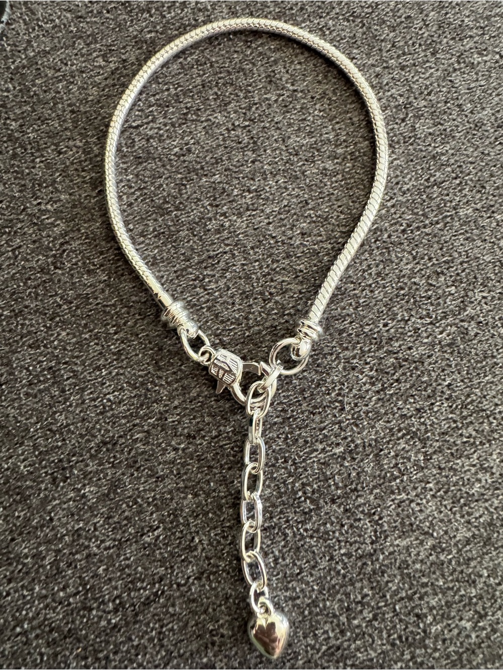 Brand new silver tone charm bracelet